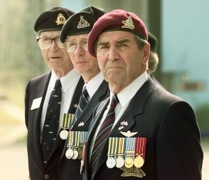 Canadian Veterans share an emotional moment during Remembrance Day ceremonies